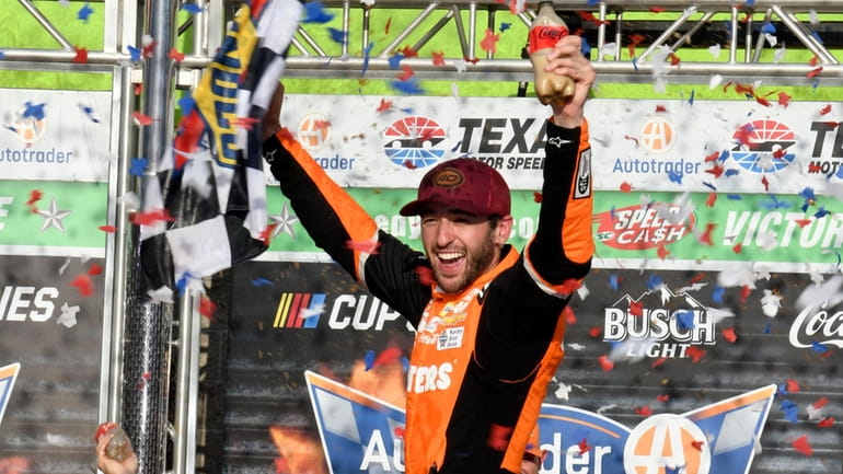 Chase Elliott celebrates his win in a NASCAR Cup Series...