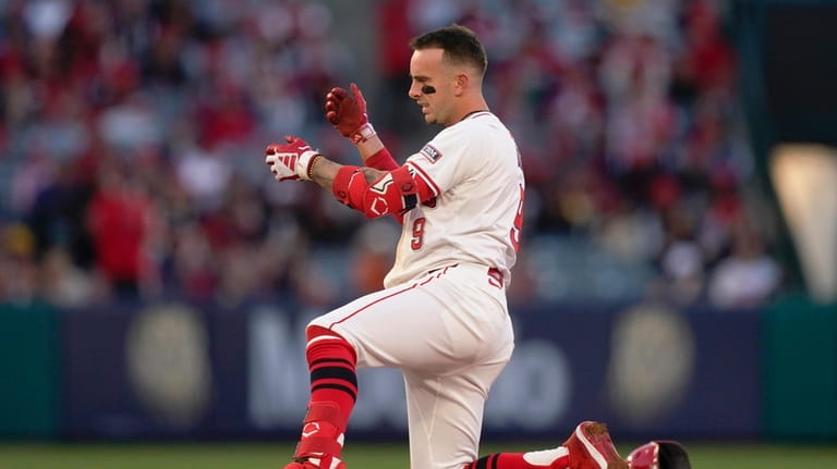 Los Angeles Angels' Zach Neto gestures after hitting a double...