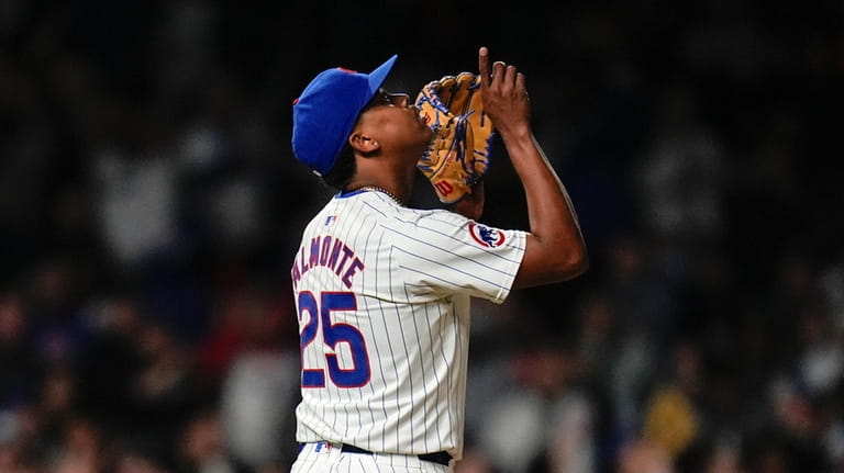 Chicago Cubs closing pitcher Yency Almonte celebrates his team's 7-2...