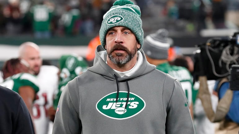 Aaron Rodgers #8 of the Jets looks on after a...