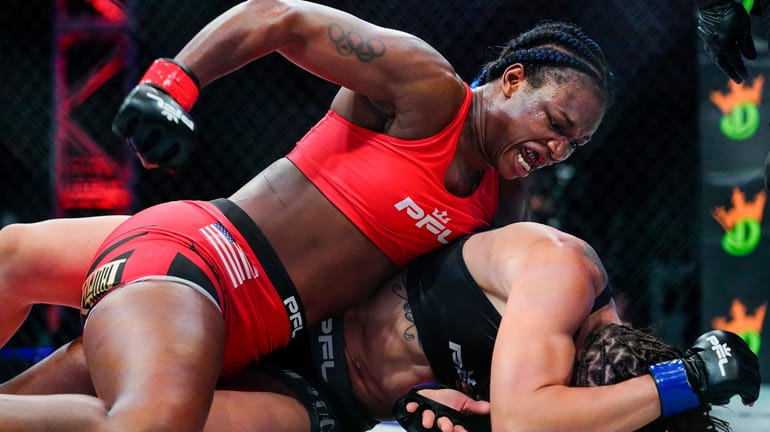 FILE -Claressa Shields, top, punches Brittney Elkin during a Professional...