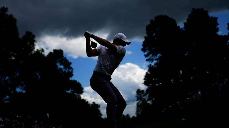 Rory McIlroy, of Northern Ireland, hits his tee shot on...
