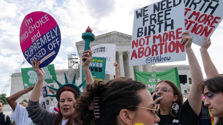 Anti-Abortion and Abortion-rights activists rally outside the Supreme Court, Wednesday,...