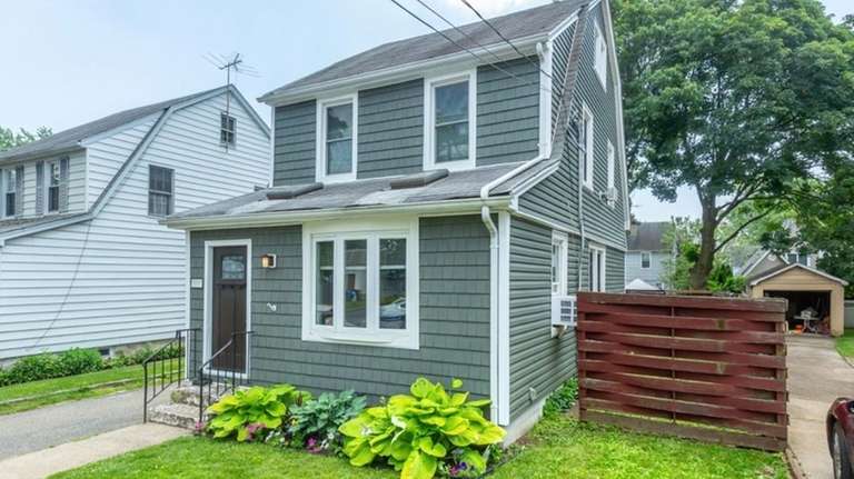 Priced at $659,000, this colonial building on Syracuse Street is made of hardwood...