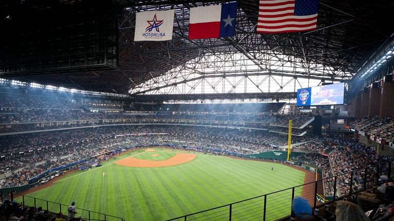 Fans find their seats at Globe Life Park before the...