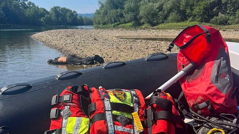 A body lies near the Drina River by the town...