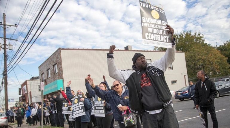 Members of TWU Local 252 rally Tuesday, Oct. 31, 2017,...