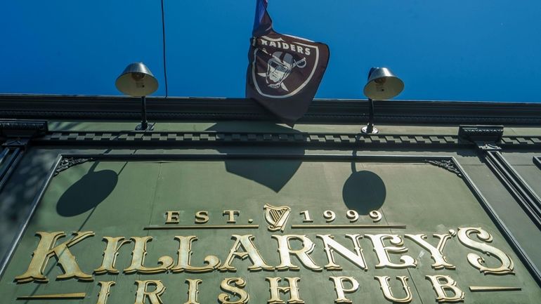 A Raiders football team flag is displayed outside Killarney's Irish...