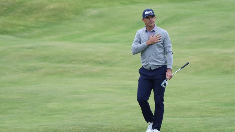 Billy Horschel of the United States reacts as he walks...