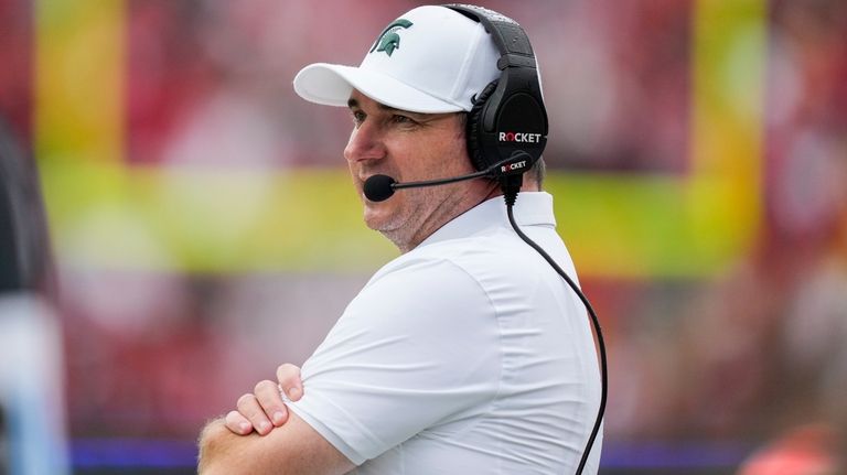 Michigan State Spartans head coach Jonathan Smith watches during the...