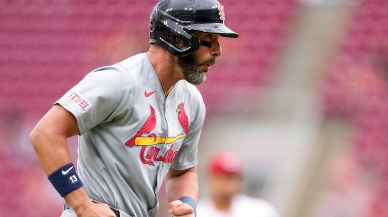 St. Louis Cardinals' Matt Carpenter reacts reacts as he rounds...