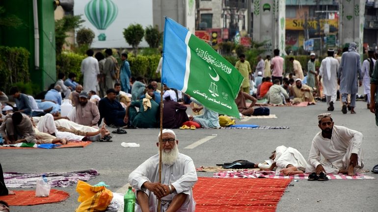 Supporters of the Pakistani religious group "Jamaat-e-Islami" stage a sit-in...