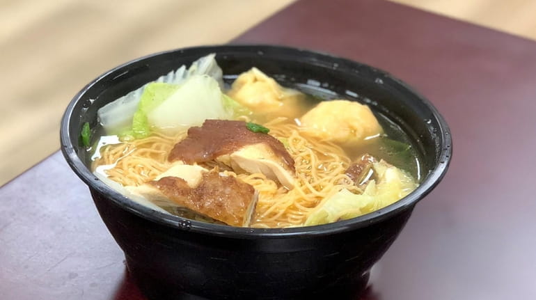 Chinese-style noodle soup with freshly roasted chicken is one of...