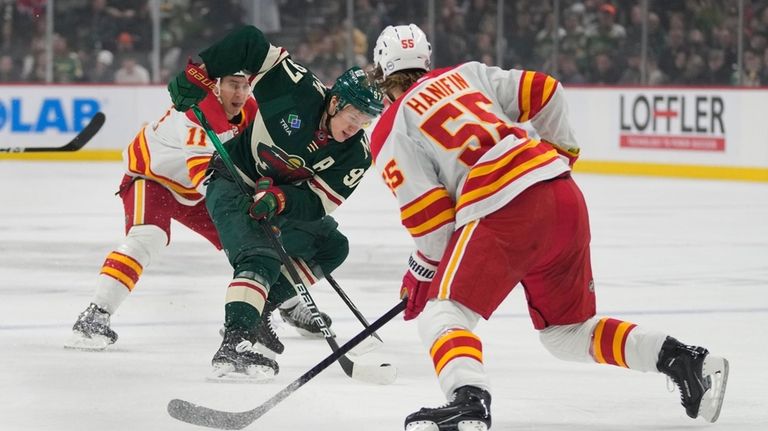 Minnesota Wild left wing Kirill Kaprizov skates with the puck...