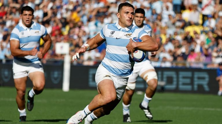 Argentina's Rodrigo Isgro runs to score a try during the...