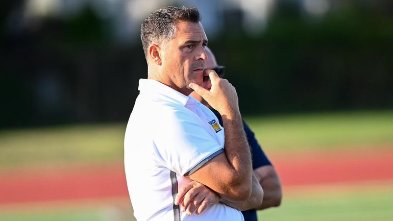 Jericho coach Dani Braga watches from the sideline during a Nassau...