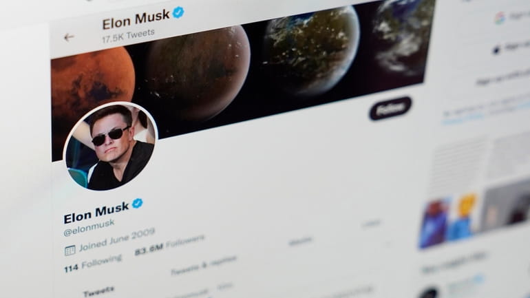 The Twitter page of Elon Musk on the screen of...