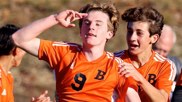 Babylon midfielder Charles Murphy reacts to the crowd after scoring the...