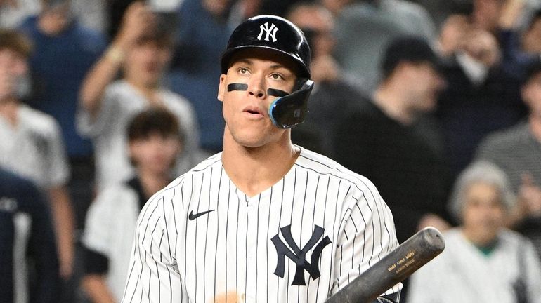 Yankees designated hitter Aaron Judge looks on while at bat...