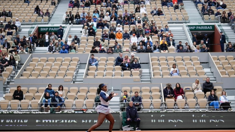 Empty seats in center court Philippe Chatrier are seen as...