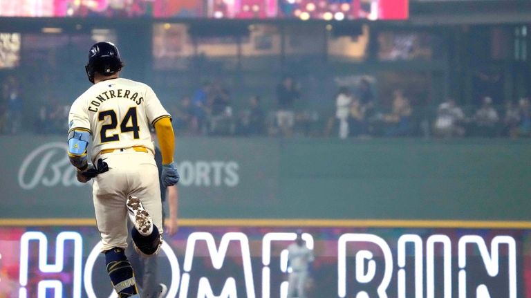 Milwaukee Brewers' William Contreras (24) runs the bases after hitting...