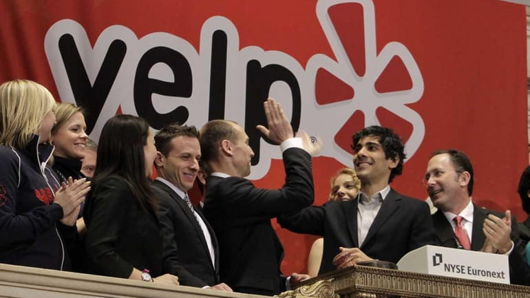Jeremy Stoppelman, second from right, Yelp co-founder and chief executive,...