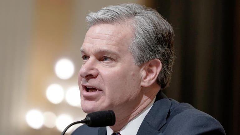 FBI Director Christopher Wray testifies during a House Select Committee...