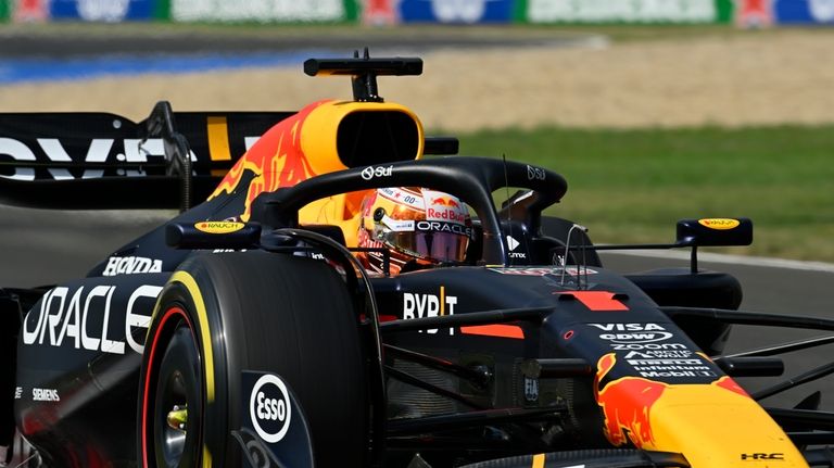 Red Bull driver Max Verstappen of the Netherlands steers his...