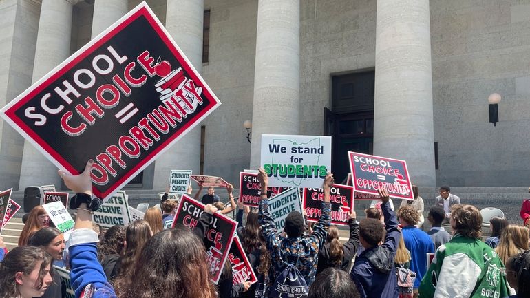 Students and parents rally at the Ohio Statehouse in support...