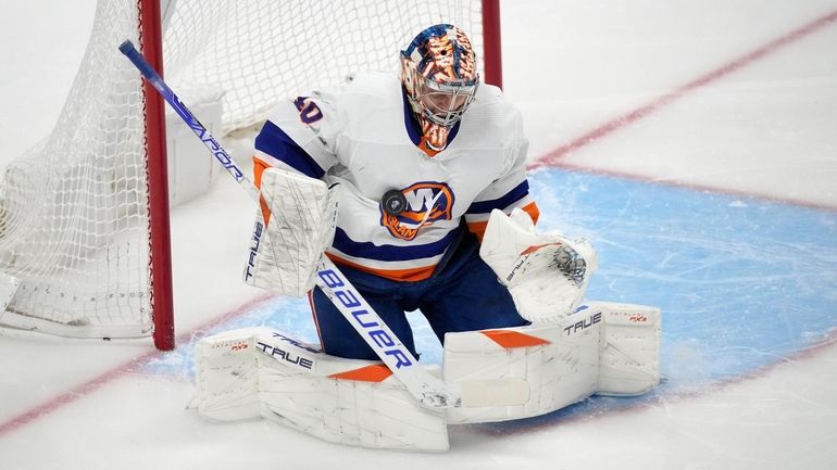 Islanders goaltender Semyon Varlamov stops the puck during the first...