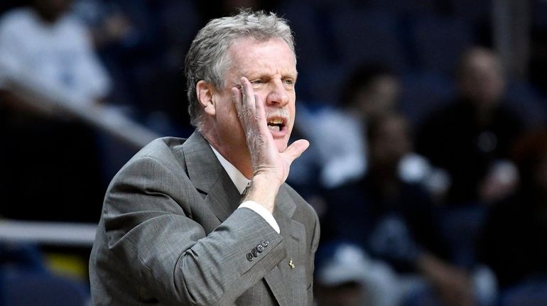 Iona head coach Tim Cluess shouts instructions to his players...