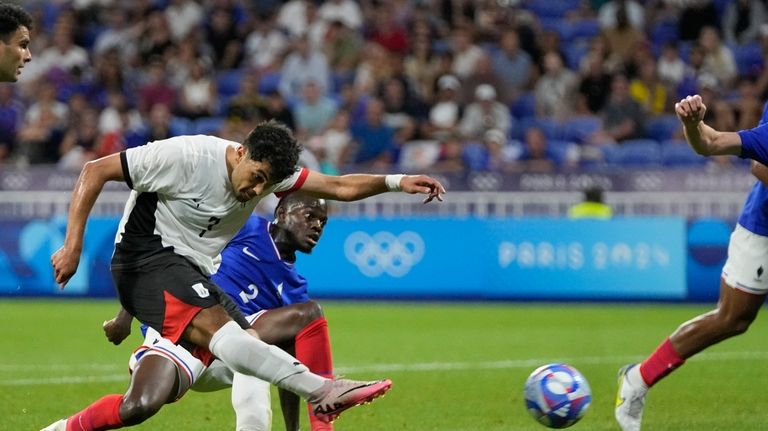 Egypt's Mahmoud Saber shoots to score his side's opening goal...