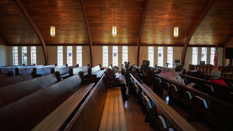 Roughly a dozen people attend pastor Ryan Burge's Sunday service...