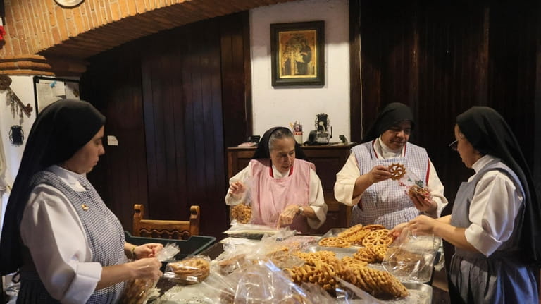 From left, nuns Alejandra Jaime, 39, Maria Ines Maldonado, 76,...