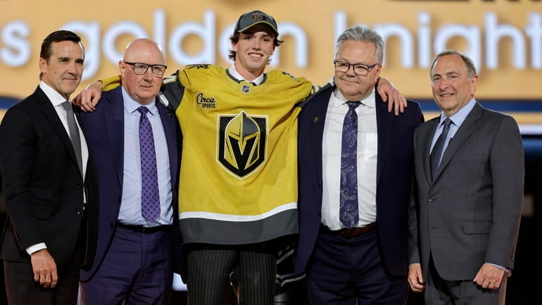 Trevor Connelly, center, poses after being selected by the Vegas...
