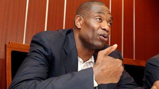 Former NBA star Dikembe Mutombo speaks during his meeting with...