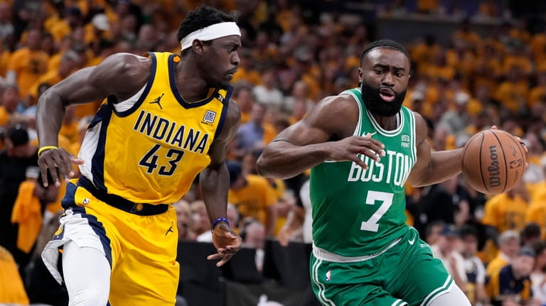 Boston Celtics guard Jaylen Brown (7) drives past Indiana Pacers...