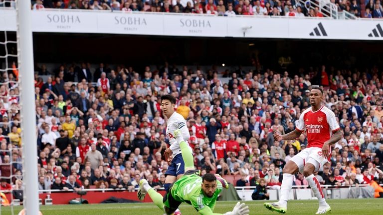 Tottenham's Son Heung-min, left, scores his side's second goal past...