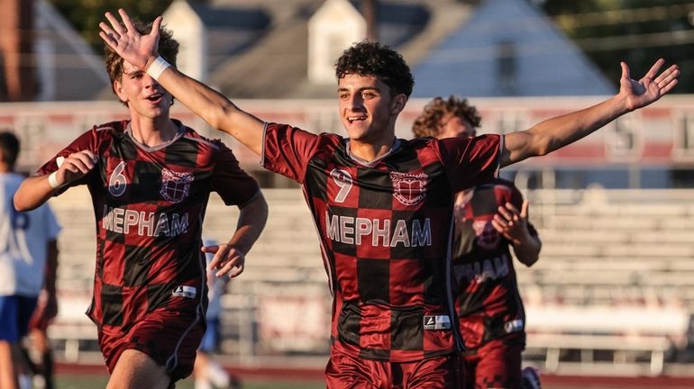 Mepham's Giorgios Karousis celebrates after scoring his first goal of a...