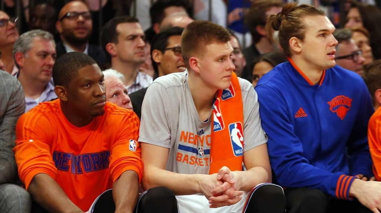 Kristaps Porzingis #6 of the New York Knicks sits on...