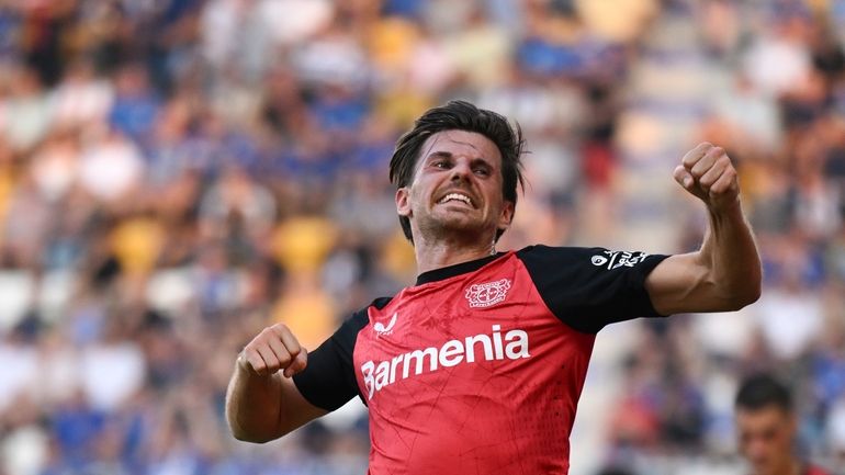 Leverkusen's Jonas Hofmann celebrates after scoring the opening goal during...