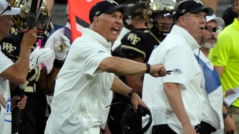 Wake Forest head coach Dave Clawson screams from the sidelines...