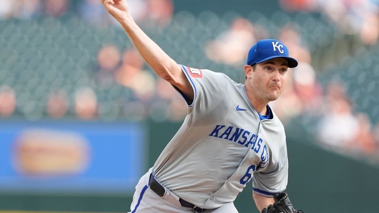 Kansas City Royals starting pitcher Seth Lugo throws during the...