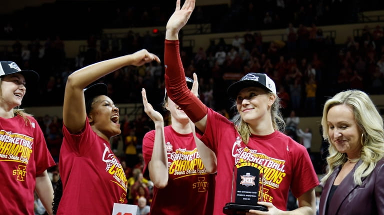 Iowa State guard Ashley Joens, second from right, waves to...