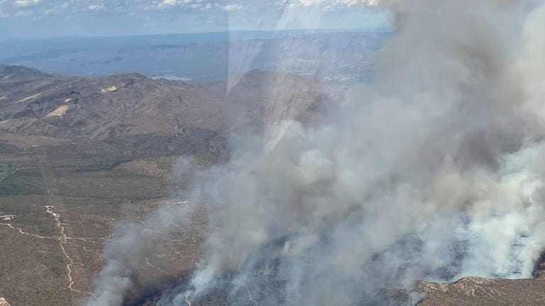 This aerial photo released by the Arizona Department of Forestry...