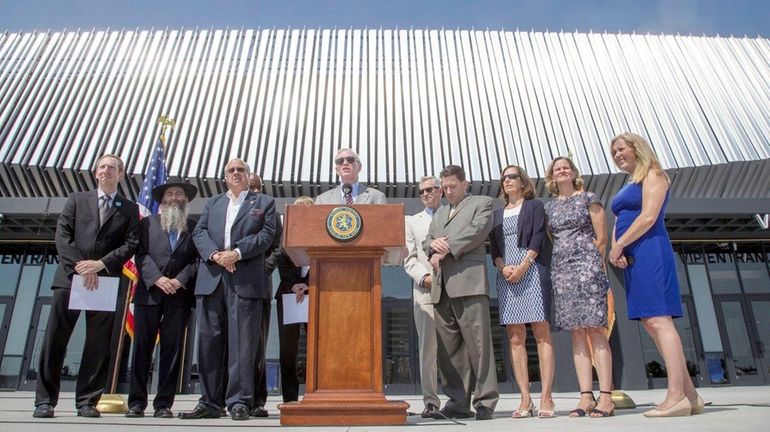 Nassau County Legis. Howard J. Kopel along county lawmakers encourage...