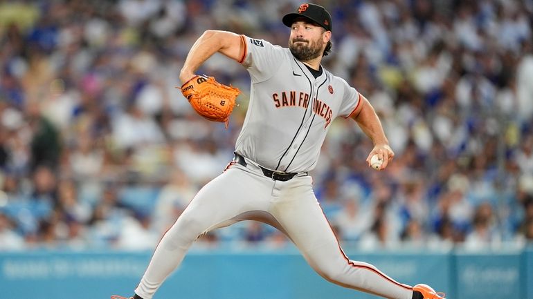 San Francisco Giants starting pitcher Robbie Ray throws during the...