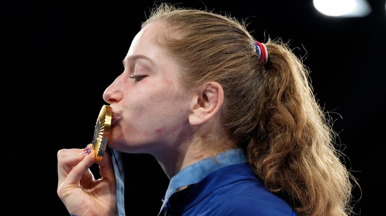 United State's Amit Elor celebrates with her gold medal during...