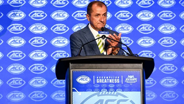 Atlantic Coast Conference commissioner Jim Phillips speaks during an NCAA...