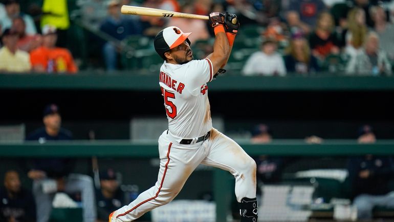 Baltimore Orioles' Anthony Santander doubles against the Cleveland Guardians during...